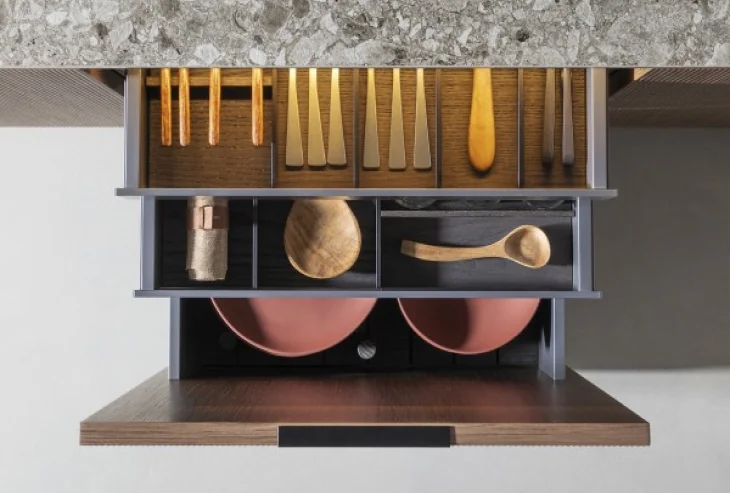 Open kitchen drawers with cutlery and cookware storage