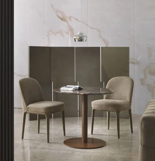 Round dining table with upholstered chairs