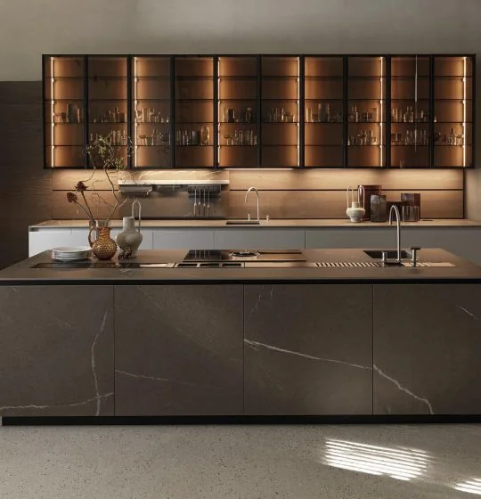 Kitchen island with illuminated wall cabinetry