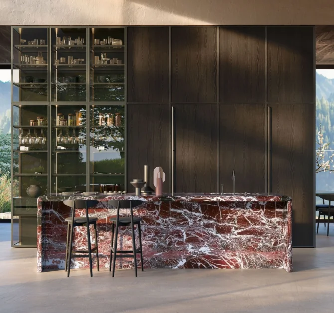 Dark wood cabinetry and display shelving with a red marble island