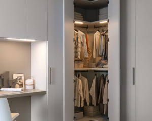 Light wardrobe cabinetry with an illuminated open clothes rail and adjoining vanity