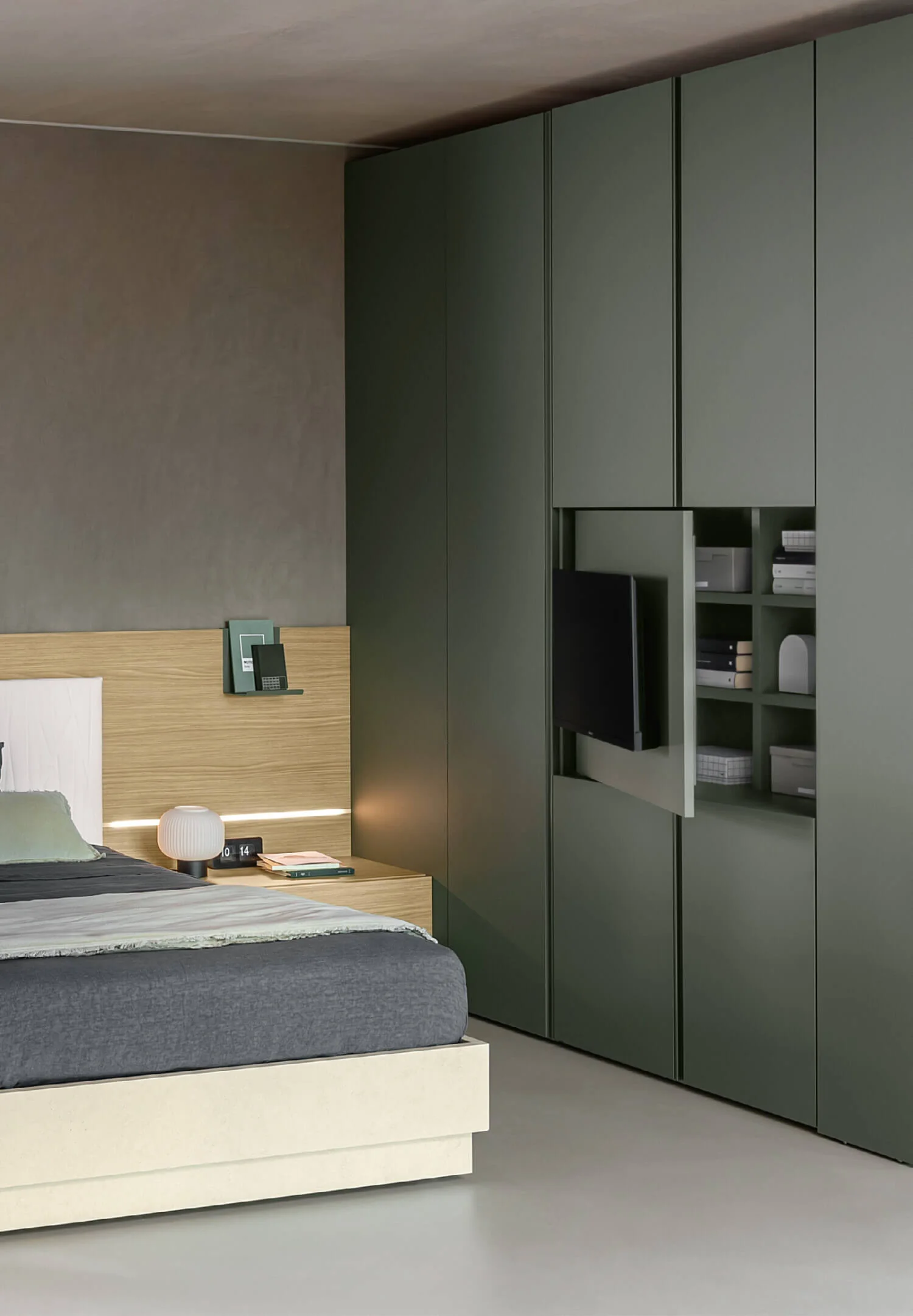 Green Alterna wardrobe with the television panel open to reveal storage