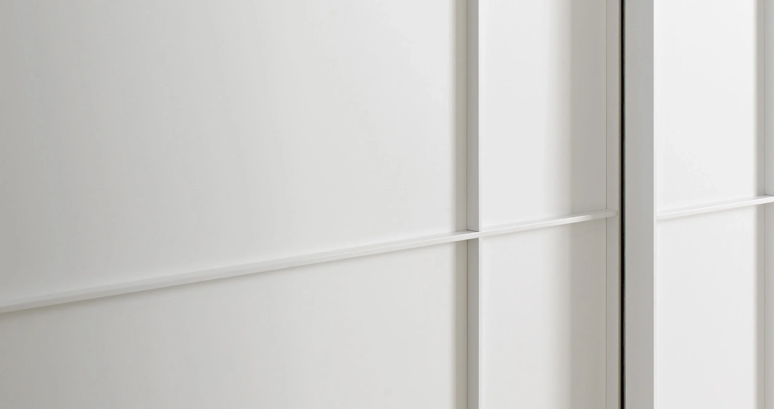 Close detail of the white Alterna Sliding door profile and handle